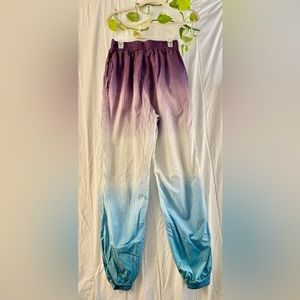 Urban Outfitters Nylon multi-color windbreaker pants. Size S-P